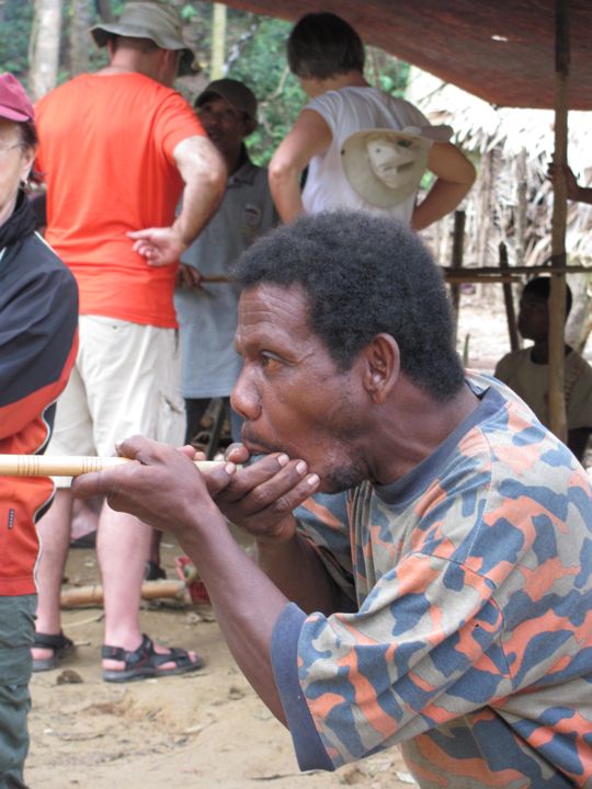 Villager Demonstrating Blow Gun