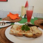 Tuna sandwich, cinnamon roll and water melon juice